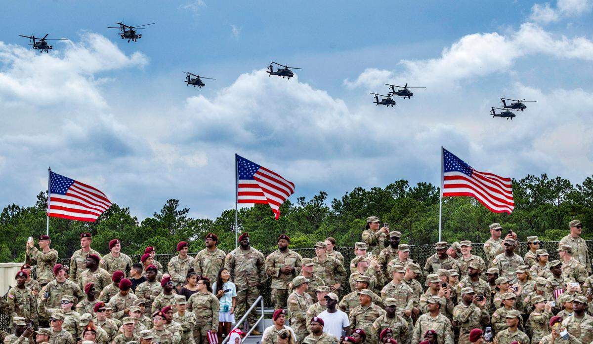 Apache helicopters fly over Fort Bragg before President Donald Trump spoke Tuesday, June 10, 2025, to mark the U.S. Army’s 250th anniversary.