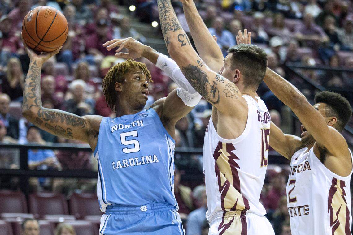 Florida State center Dominik Olejniczak (15) and guard Anthony Polite (2) trap North Carolina forward Armando Bacot (5) in the first half of an NCAA college basketball game in Tallahassee, Fla., Monday, Feb. 3, 2020.