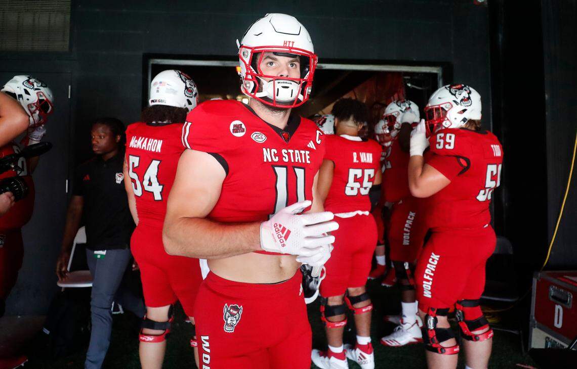 N.C. State linebacker Payton Wilson (11) and teammates get ready to head out onto the field to warmup before N.C. State’s game against Notre Dame at Carter-Finley Stadium in Raleigh, N.C., Saturday, Sept. 9, 2023.