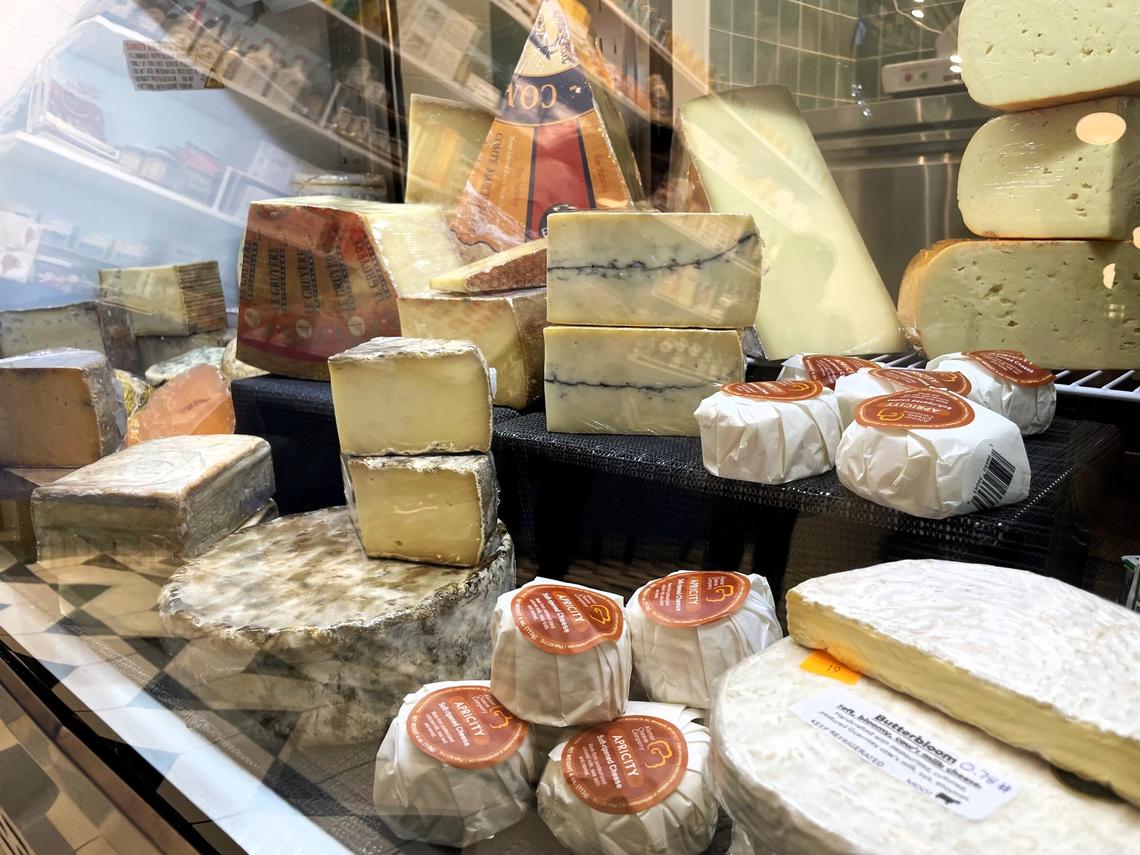 A variety of blue, washed rind, hard and soft cheese fill one of three refrigerated cases at Wedgewood Cheese Bar in Carrboro. Cheesemonger Stevie Webb encourages people to explore new varieties before deciding what to serve at their next get-together.