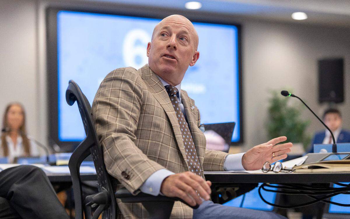 UNC Board of Trustees member Richard E. Allison Jr. questions Rick Barakat, Chief Revenue Officer for Carolina Athletics, during a Trustees meeting on Wednesday, May 21, 2025 in Chapel Hill, N.C.