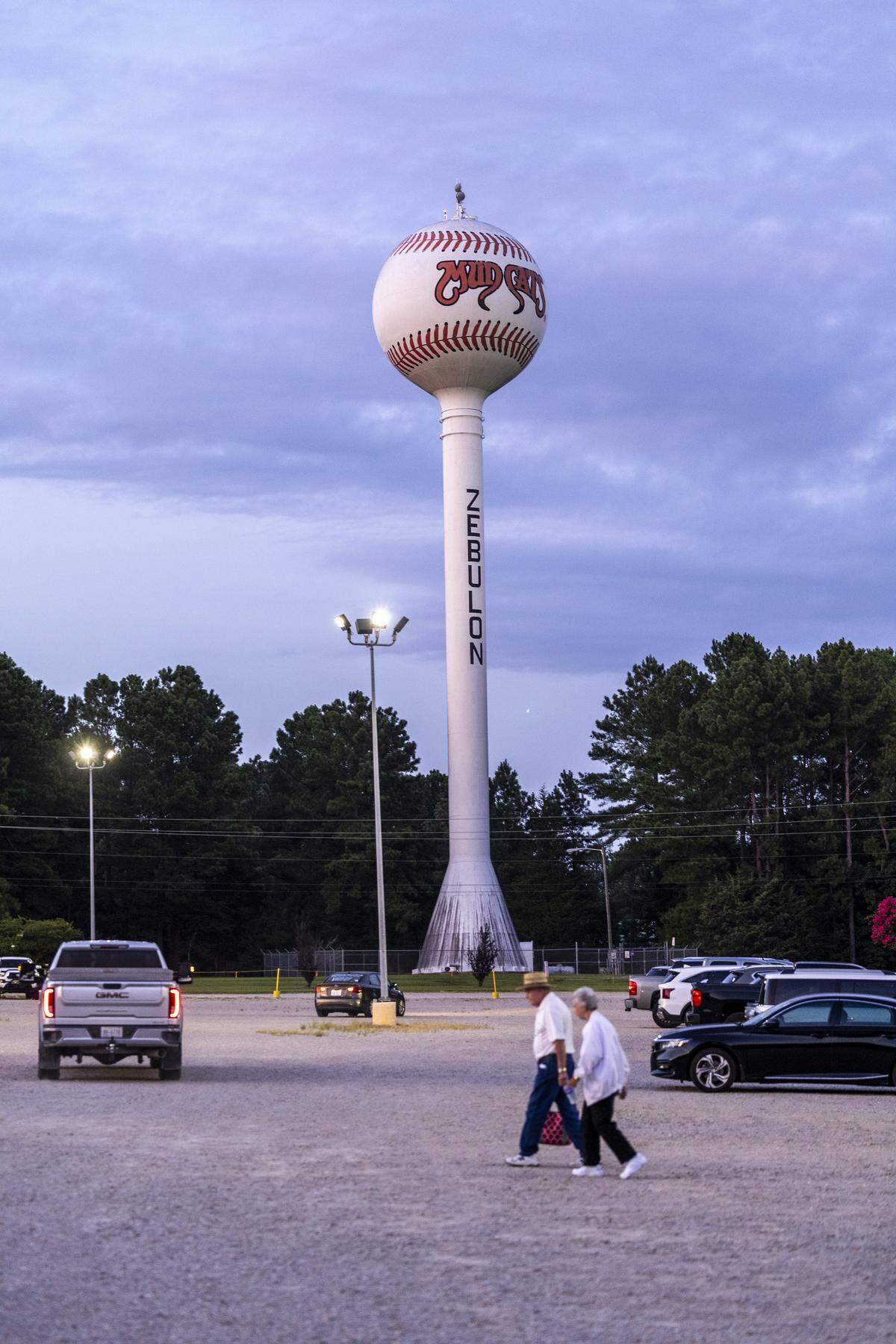 Fans walk back to their cars following a recent game against the Kannapolis Cannon Ballers on Tuesday, July 22, 2025, at Five County Stadium in Zebulon, N.C. The Mudcats will conclude their 35th and final season in Zebulon.