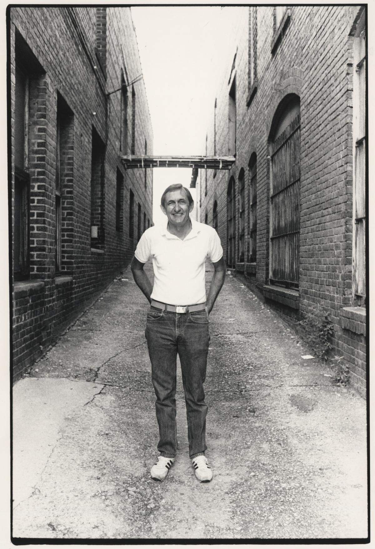 Dennis Rogers in one of a series of John Rottet photos taken for the cover of a book of his columns, “It’s Bad News When the Bartender Cries.”