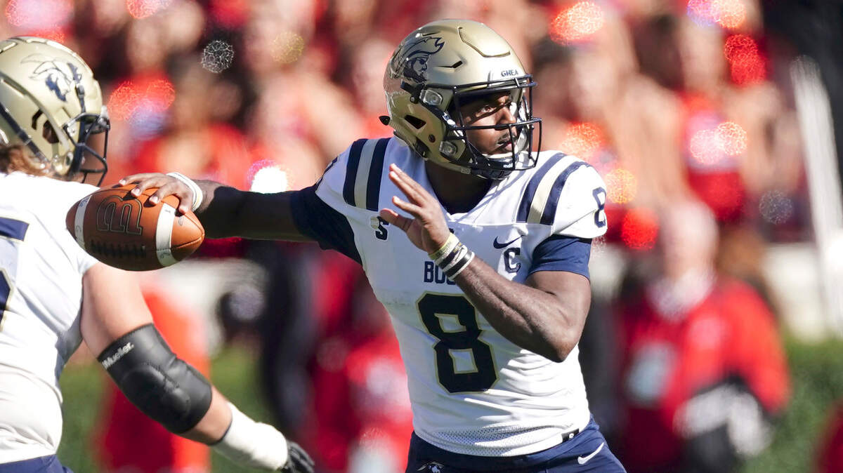 Charleston Southern quarterback Jack Chambers (8) throws a pass in the second half of an NCAA college football game against Georgia Saturday, Nov. 20, 2021, in Athens, Ga..