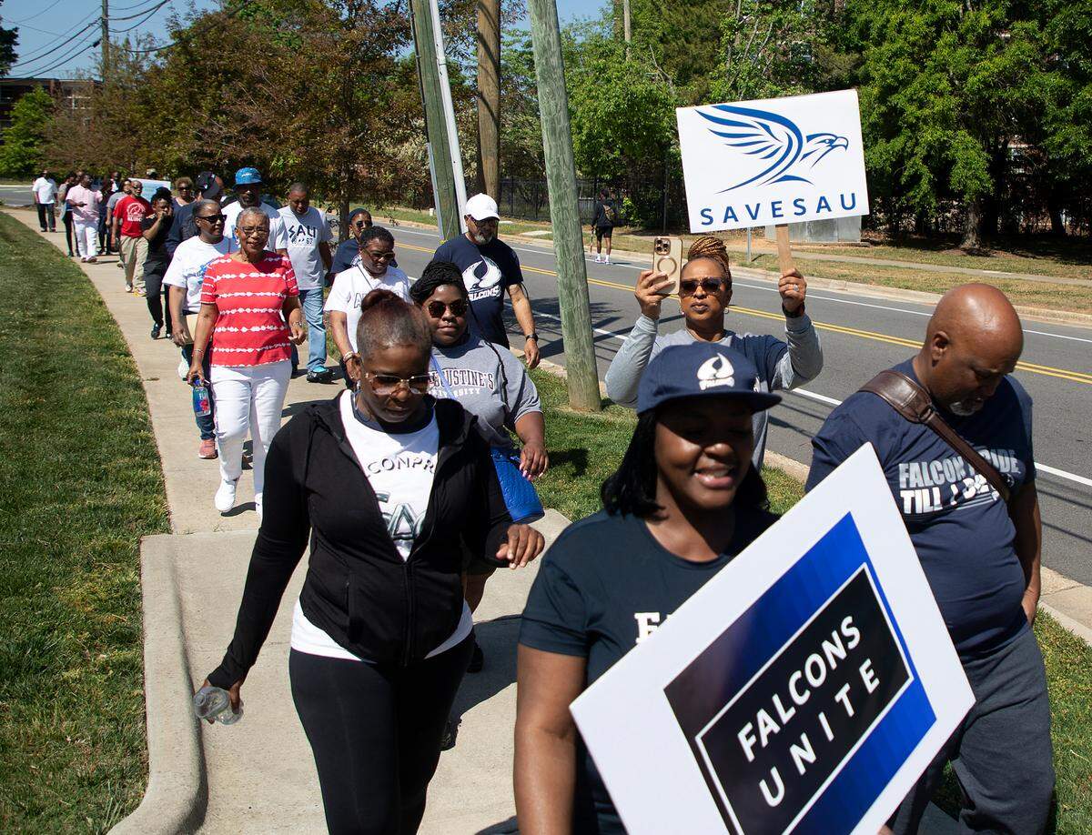 People march during a rally to save St. Augustine’s University in Raleigh, N.C. on Monday, April 29, 2024. The event was organized by the Capital City Hope Foundation, Falcons Unite, and the SAVESAU Coalition.