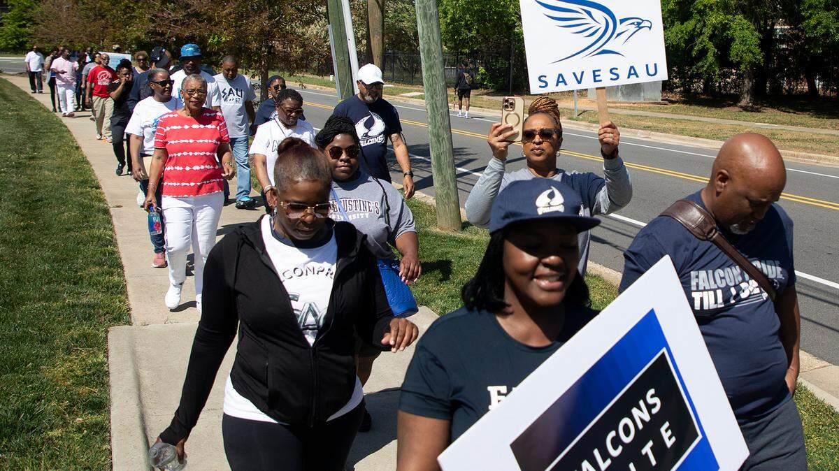 People march during a rally to save St. Augustine’s University in Raleigh, N.C. on Monday, April 29, 2024. The event was organized by the Capital City Hope Foundation, Falcons Unite, and the SAVESAU Coalition.