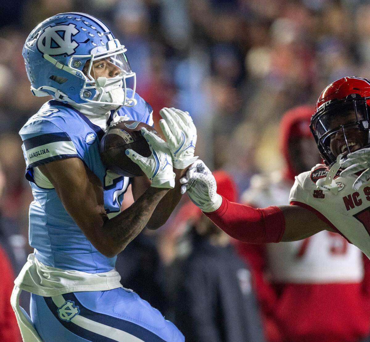 North Carolina receiver Chris Culliver (13) pulls in a 50-yard pass from quarterback Jacolby Criswell for a touchdown in the third quarter against N.C. State on Saturday, November 30, 2024 at Kenan Stadium in Chapel Hill, N.C.
