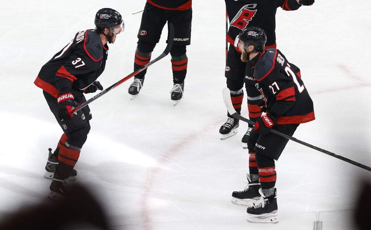 Carolina's Andrei Svechnikov (37) celebrates with Nikolaj Ehlers (27) after scoring in the second period of the Hurricanes’ game against the Golden Knights in the fifth game of the Stanley Cup Final at the Lenovo Center in Raleigh, N.C., Thursday, June 11, 2026.