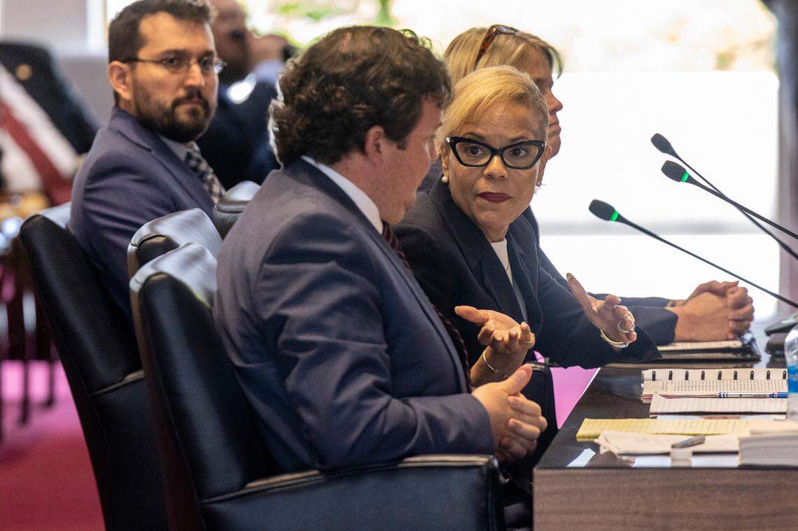 Gov. Roy Cooper’s Chief of Staff Kristi Jones, right, and General Counsel Eric Fletcher, center, testify before the House Oversight and Reform Committee to respond to accusations of meddling in the SBI by its Director Bob Schurmeier Tuesday, May 2, 2023 at the State Legislative Building.