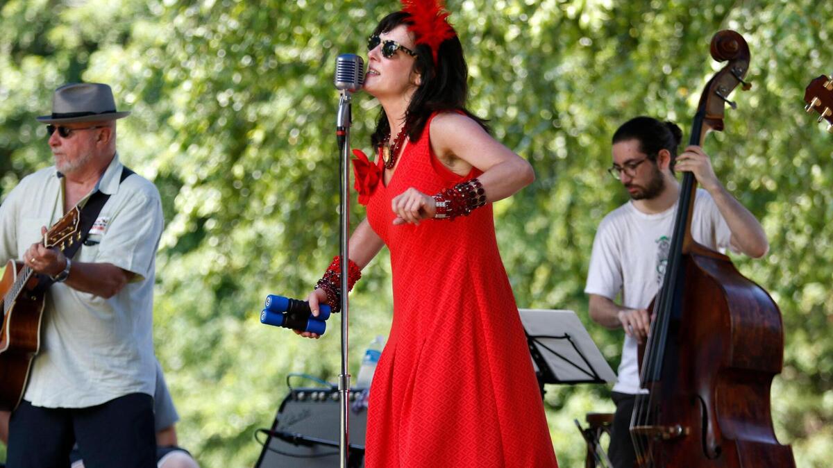 Singer Christy Benson sings the jazz and blues along with members of the triangle indie jazz band Tea Cup Gin at the Festival for the Eno in 2017. The 2018 festival  promises more than 70 bands on five stages.