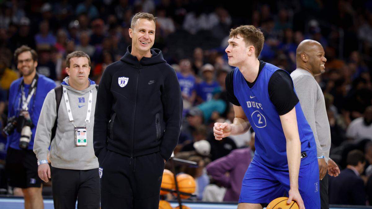 Duke coach Jon Scheyer laughs with Cooper Flagg during the Blue Devils’ practice session at the Final Four in Houston, Friday, April 4, 2025.