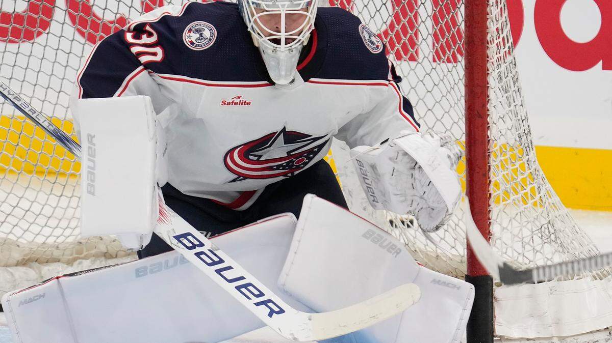 Columbus Blue Jackets goaltender Spencer Martin (30) makes a save during warm up before a game against the Toronto Maple Leafs at Scotiabank Arena.