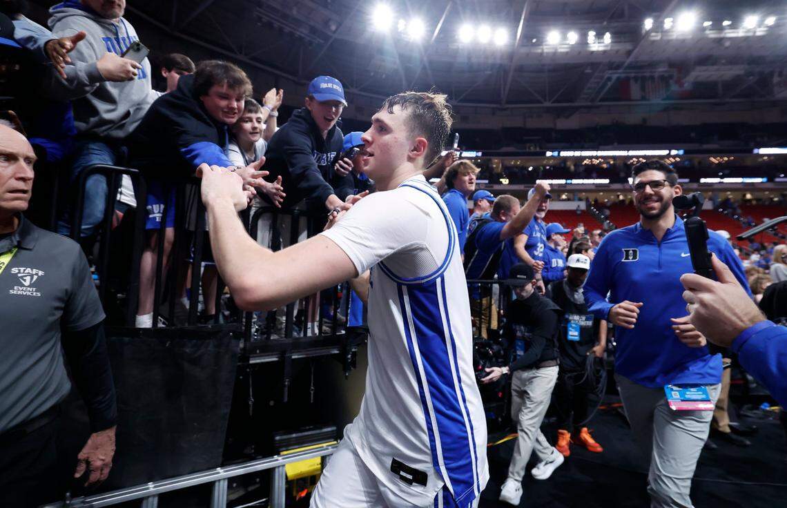 Fans congratulate Duke’s Cooper Flagg as he comes off the court after Duke’s 89-66 victory over Baylor in the second round of the 2025 NCAA men’s basketball championship at the Lenovo Center in Raleigh, N.C., Sunday, March 23, 2025.