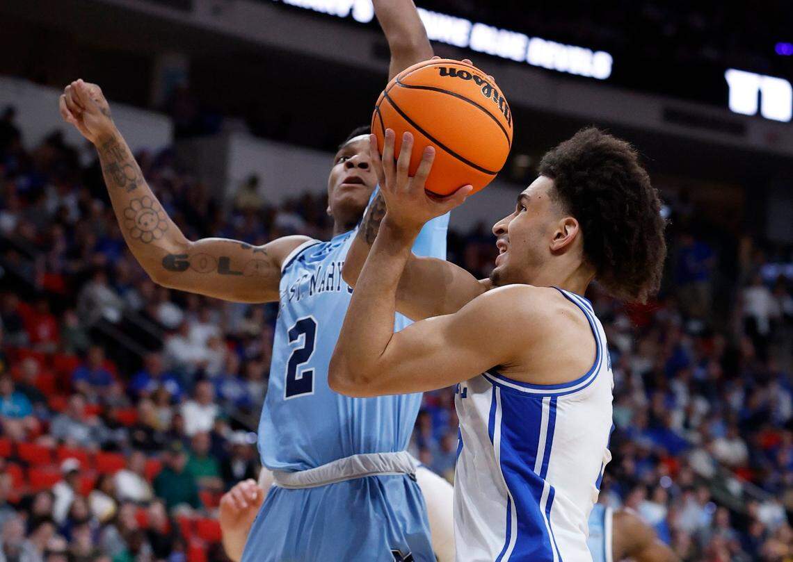 Duke’s Tyrese Proctor (5) drives past Mount St. Mary’s Arlandus Keyes (2) during the first half of Duke’s game against Mount St. Mary’s in the first round of the 2025 NCAA Men’s Basketball Tournament at the Lenovo Center in Raleigh, N.C., Friday, March 21, 2025.