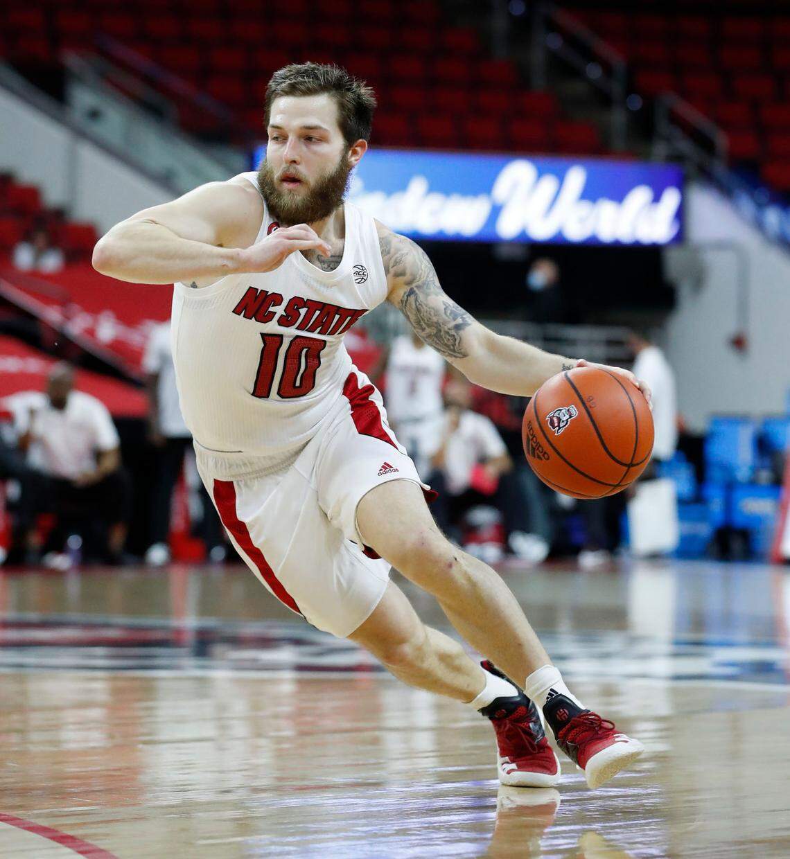N.C. State’s Braxton Beverly (10) drives towards the basket during the first half of N.C. State’s game against Pittsburgh at PNC Arena in Raleigh, N.C., Sunday, February 28, 2021.