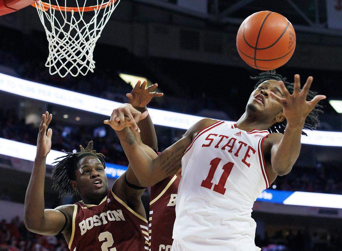 N.C. State’s Dennis Parker Jr. grabs a rebound away from Boston College’s Armani Mighty during the second half of the Wolfpack’s 81-70 win on Saturday, Feb. 24, 2024, at PNC Arena in Raleigh, N.C.
