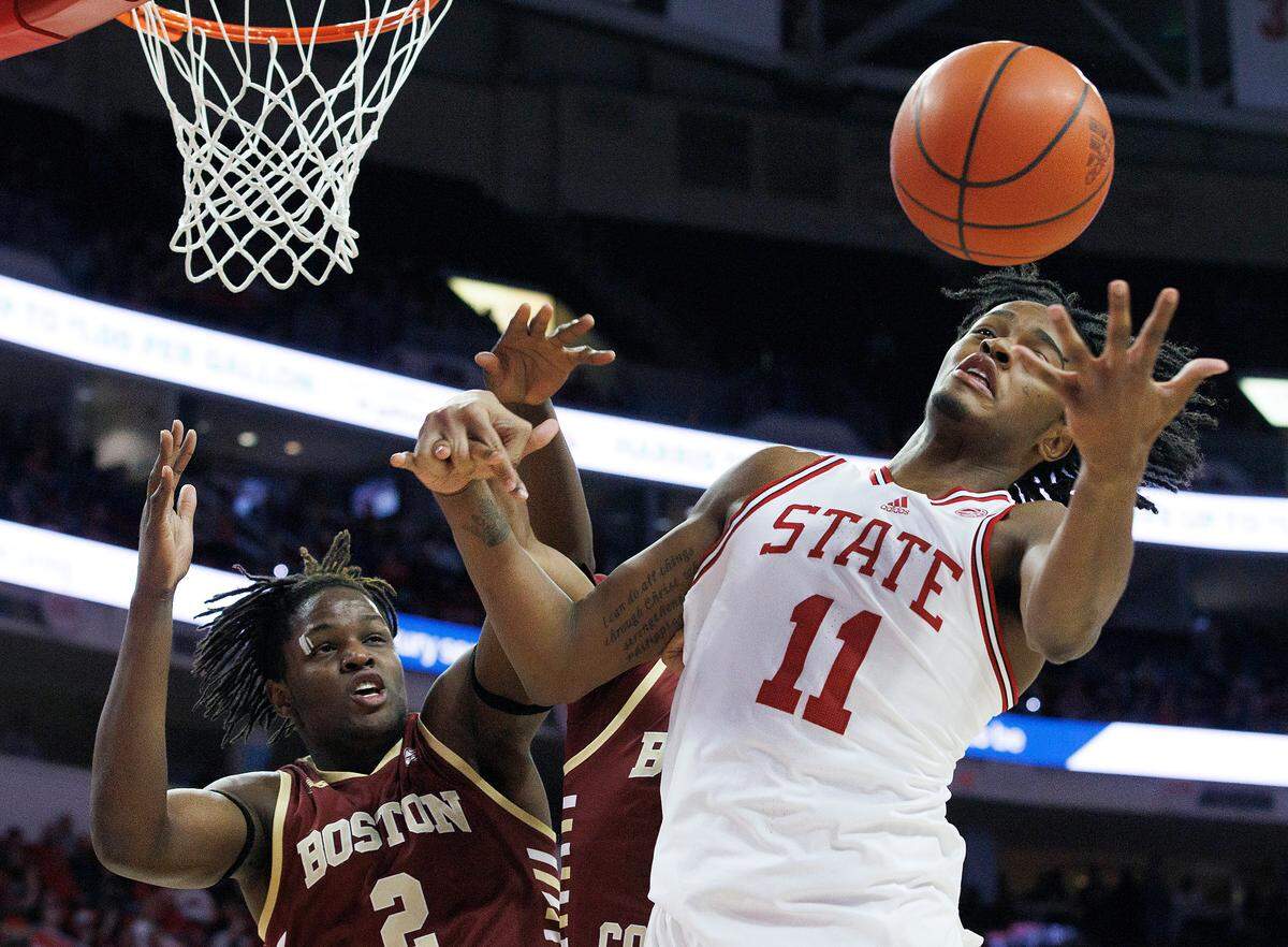 N.C. State’s Dennis Parker Jr. grabs a rebound away from Boston College’s Armani Mighty during the second half of the Wolfpack’s 81-70 win on Saturday, Feb. 24, 2024, at PNC Arena in Raleigh, N.C.