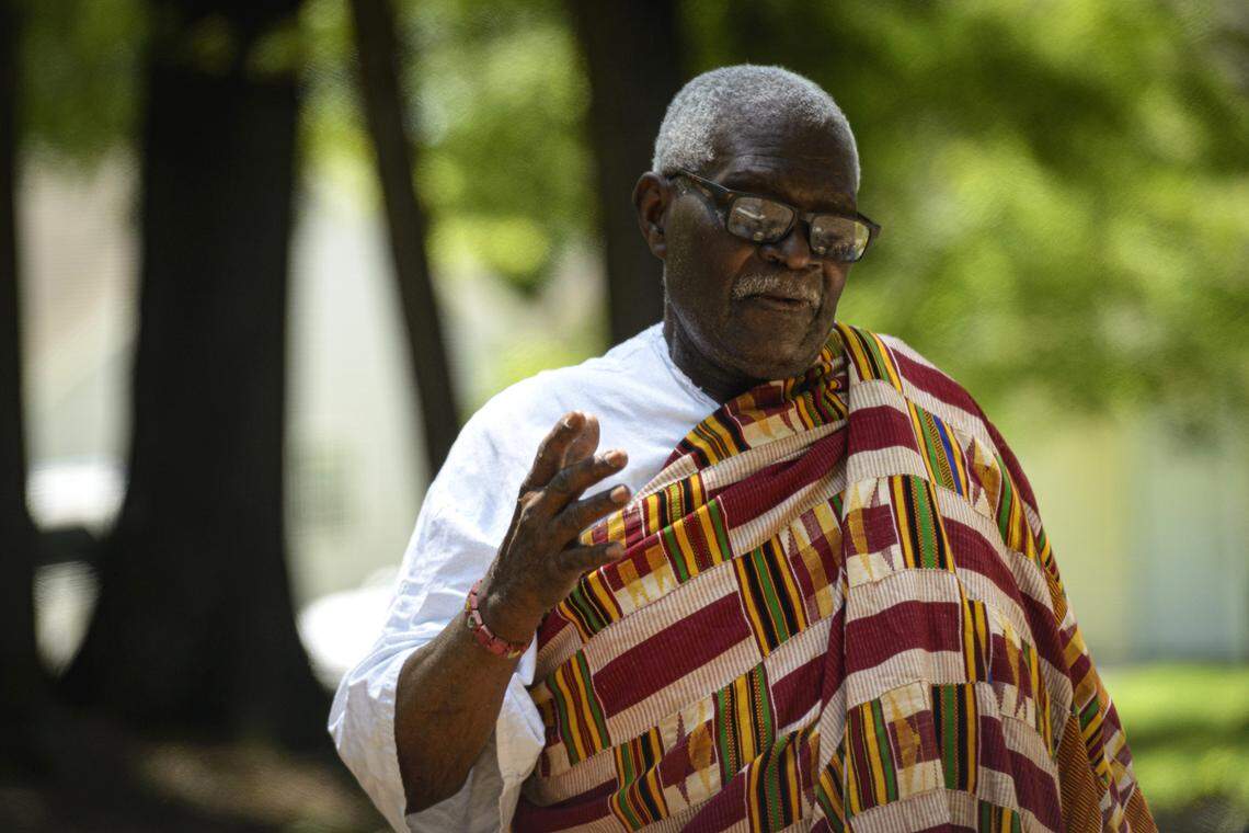 Dr. Victor Maafo performs a libation ceremony of remembrance at the Geer Cemetery in Durham, NC, on June 22, 2019.
