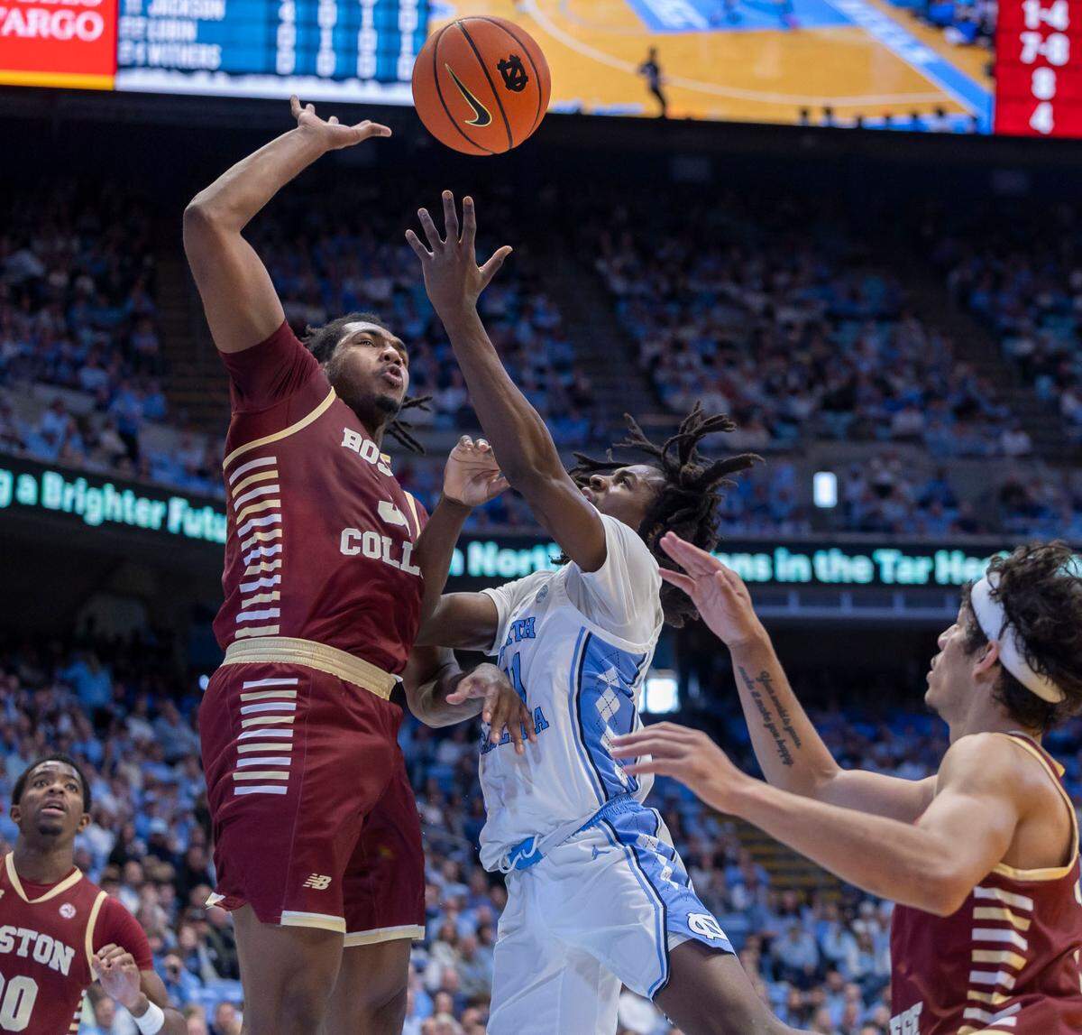 Boston College forward Chad Venning (32) blocks a shot attempt by North Carolina guard Ian Jackson (11) in the first half on Saturday, January 25, 2025 at the Smith Center in Chapel Hill, N.C.
