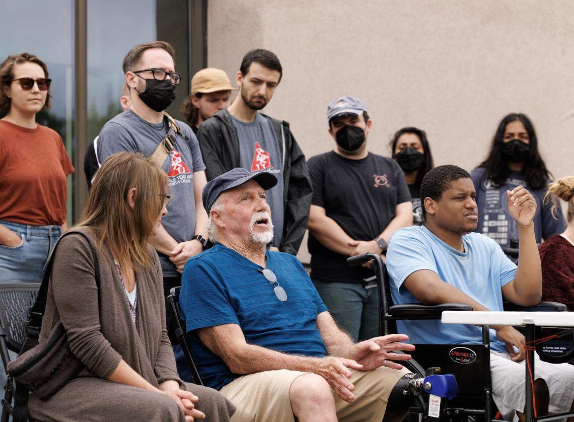 Dale Weldele, center, a displaced resident of Camelot Village, speaks during a press conference on Wednesday, Aug. 20, 2025, in Durham, N.C., about his experience after floodwaters from Tropical Depression Chantal severely damaged his apartment. Some displaced residents have been living in a Comfort Inn, accommodations paid for with emergency funds from Chapel Hill and Orange County. That ends next week, leaving at least six people at risk of homelessness.
