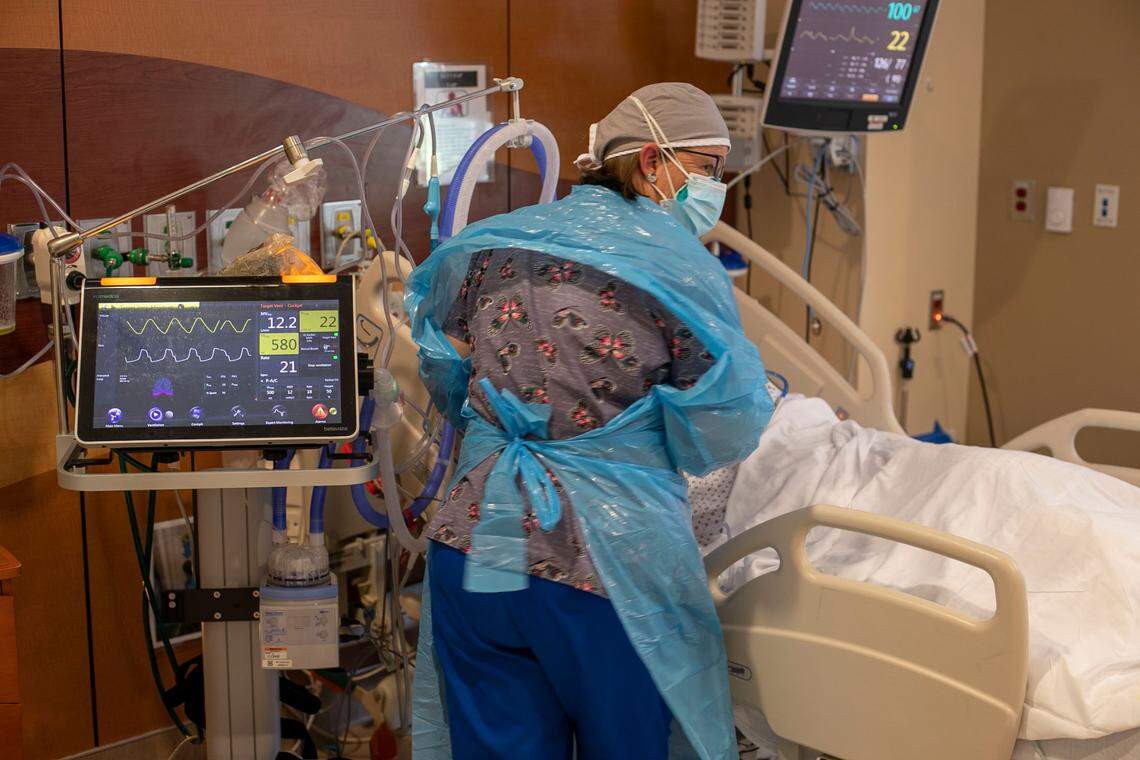 Respiratory Therapist Lisa Ramsey attends to a COVID-19 patient the intensive care unit at Johnston UNC Health Care on Thursday, August 19. 2021 in Clayton, N.C. The 10-bed intensive care unit is completely full of COVID-19 patient
