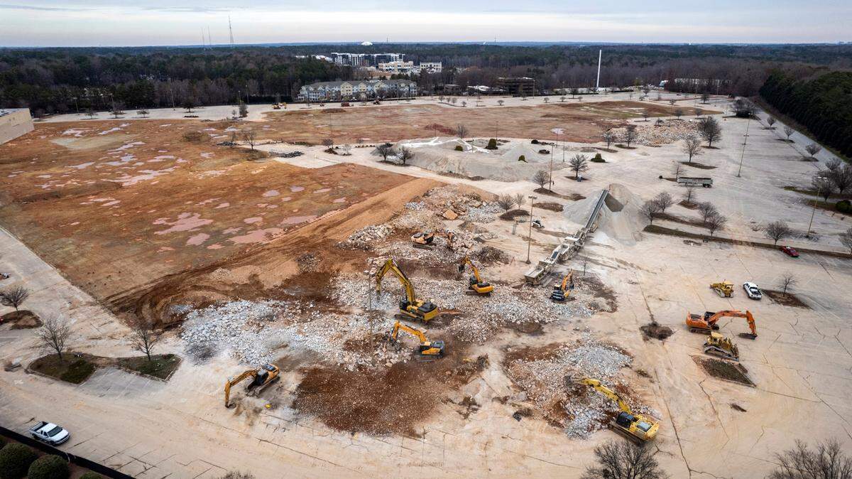 A demolition crew demolishes the last remnants of Cary Towne Center Tuesday, Dec. 20, 2022. The site will be the future home of Epic Games.