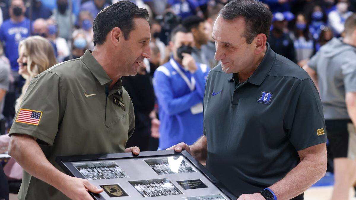 Army head coach Jimmy Allen gives Duke head coach Mike Krzyzewski a ceremonial plaque before Duke’s game against Army at Cameron Indoor Stadium in Durham, N.C., Friday, November 12, 2021.