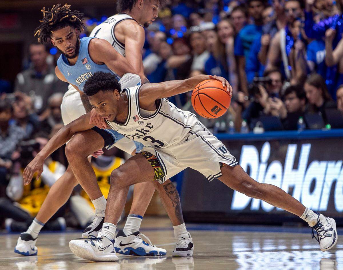 North Carolina’s R.J. Davis (4) defends Duke’s Jeremy Roach (3) during the second half on Saturday, February 4, 2023 at Cameron Indoor Stadium in Durham, N.C.