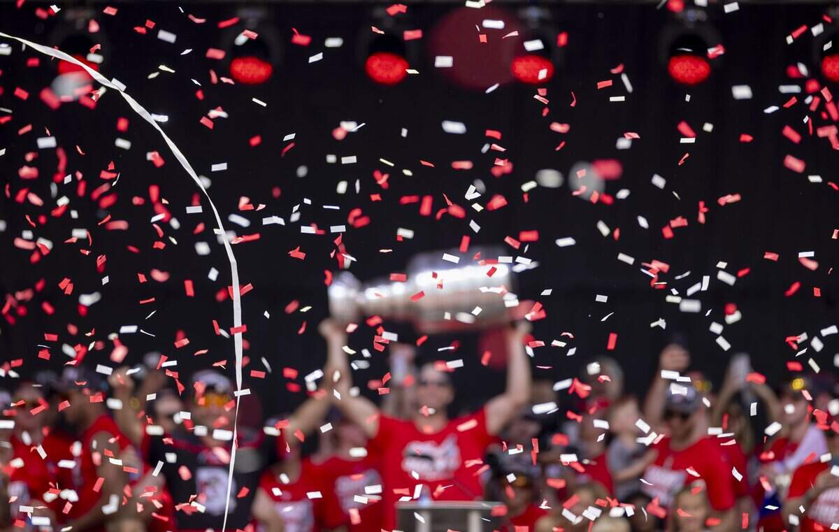 Carolina Hurricanes captain Jordan Staal hoists the Stanley Cup, as a sea of confetti falls, during the rally on the City Plaza on Saturday, June 20, 2026 in Raleigh, NC.
