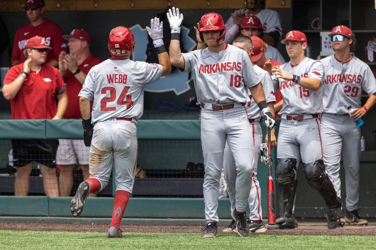 Arkansas Braydon Webb (24) scores on a base hit by Brady Slavens (17) in the fifth inning to give the Razorbacks a 3-0 lead over North Carolina during the first game of their Super Regional series on Saturday, June 11, 2022 at Boshamer Stadium in Chapel Hill, N.C.