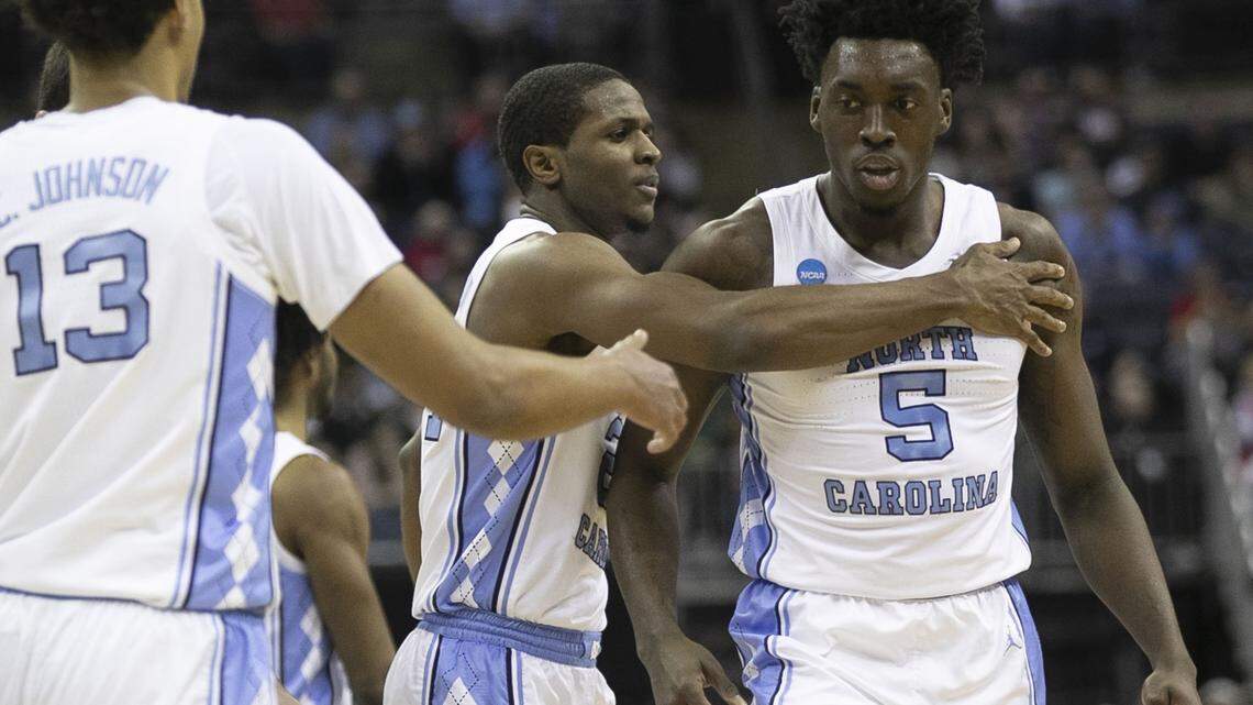 North Carolina’s Kenny Williams (24) embraces teammate Nassir Little (5) after Litle scored and drew a foul during the first half against Washington in the second round of the NCAA Tournament on Sunday, March 24, 2019 at Nationwide Arena in Columbus, Ohio.