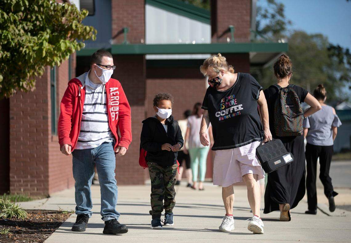 Jayden Williams, a kindergartener at Pine Level Elementary School, leaves campus at the end of the school day on Tuesday, October 13, 2020 in Pine Level, N.C. This is the second full day for 50 students who have retuned to the classroom for in-person learning during the COVID-19 pandemic.