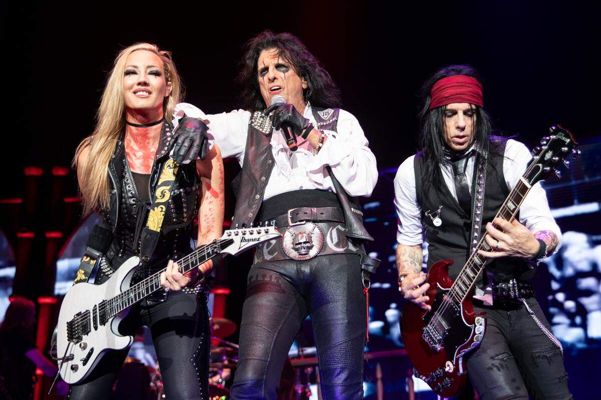 Alice Cooper (center) with Nita Strauss (left) and Tommy Hendricksen bring their “Freaks On Parade 2023 Tour” to Raleigh, N.C.’s Coastal Credit Union Music Park at Walnut Creek, Tuesday night, Aug. 29, 2023.