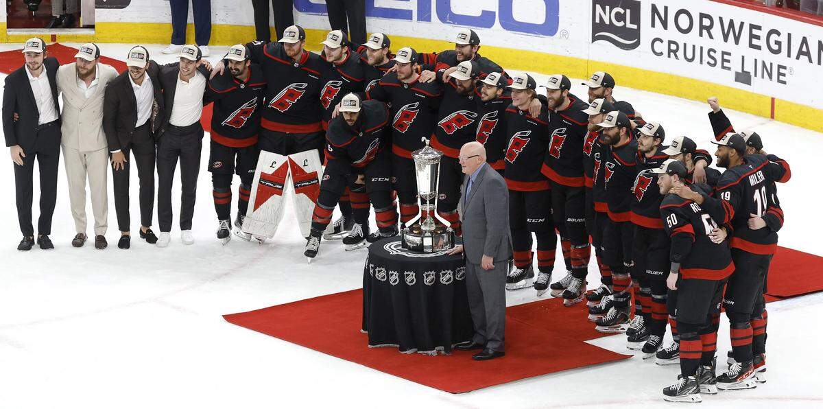 The Carolina Hurricanes pose with the Prince of Wales trophy after their 6-1 victory over the Canadiens in game five of the Eastern Conference Finals at the Lenovo Center Friday, May 29, 2026.