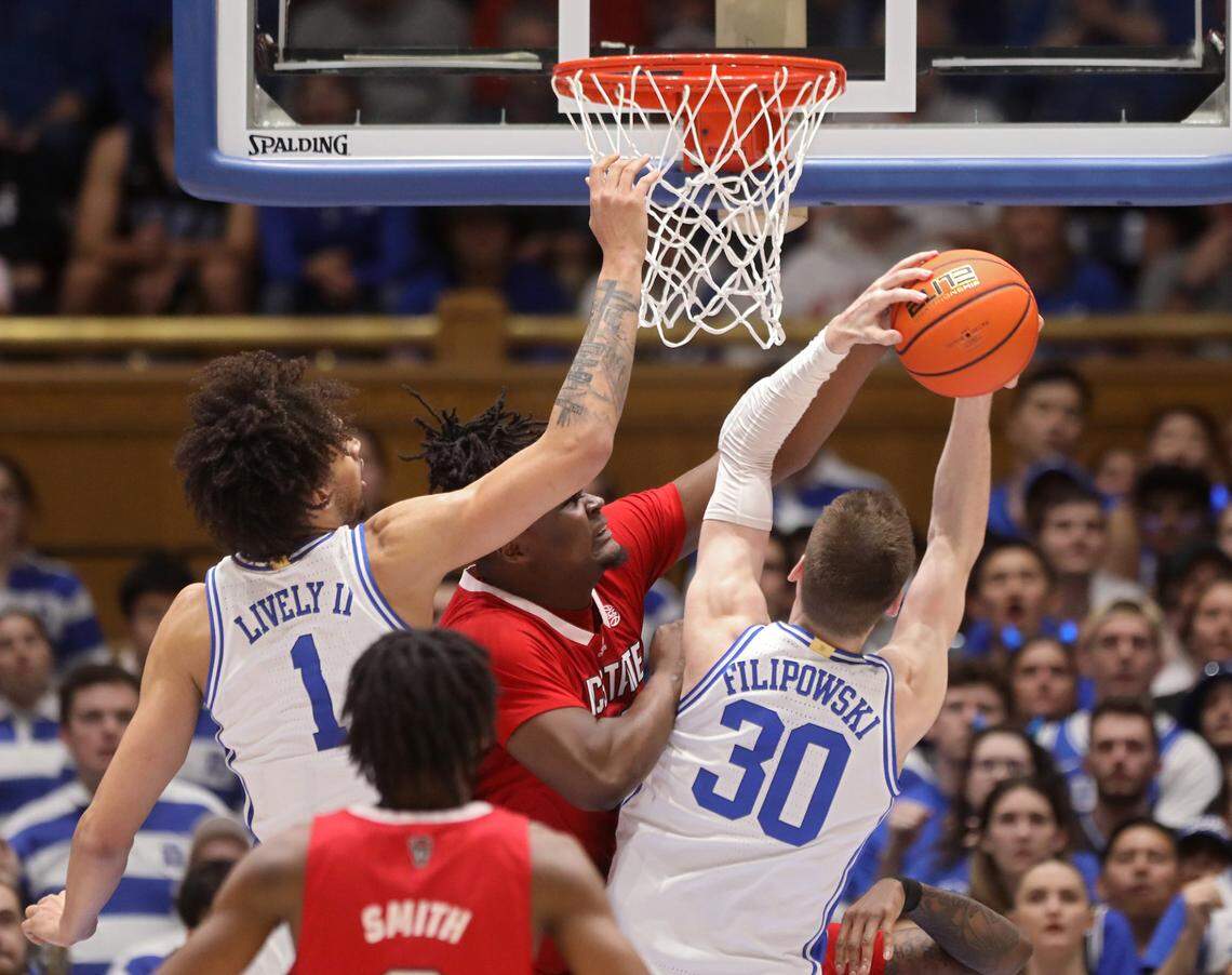 Duke’s Kyle Filipowski pulls a rebound away from N.C. State’s D.J. Burns Jr. during the first half of the Blue Devils’ 71-67 win over N.C. State on Tuesday, Feb. 28, 2023, at Cameron Indoor Stadium in Durham, N.C.