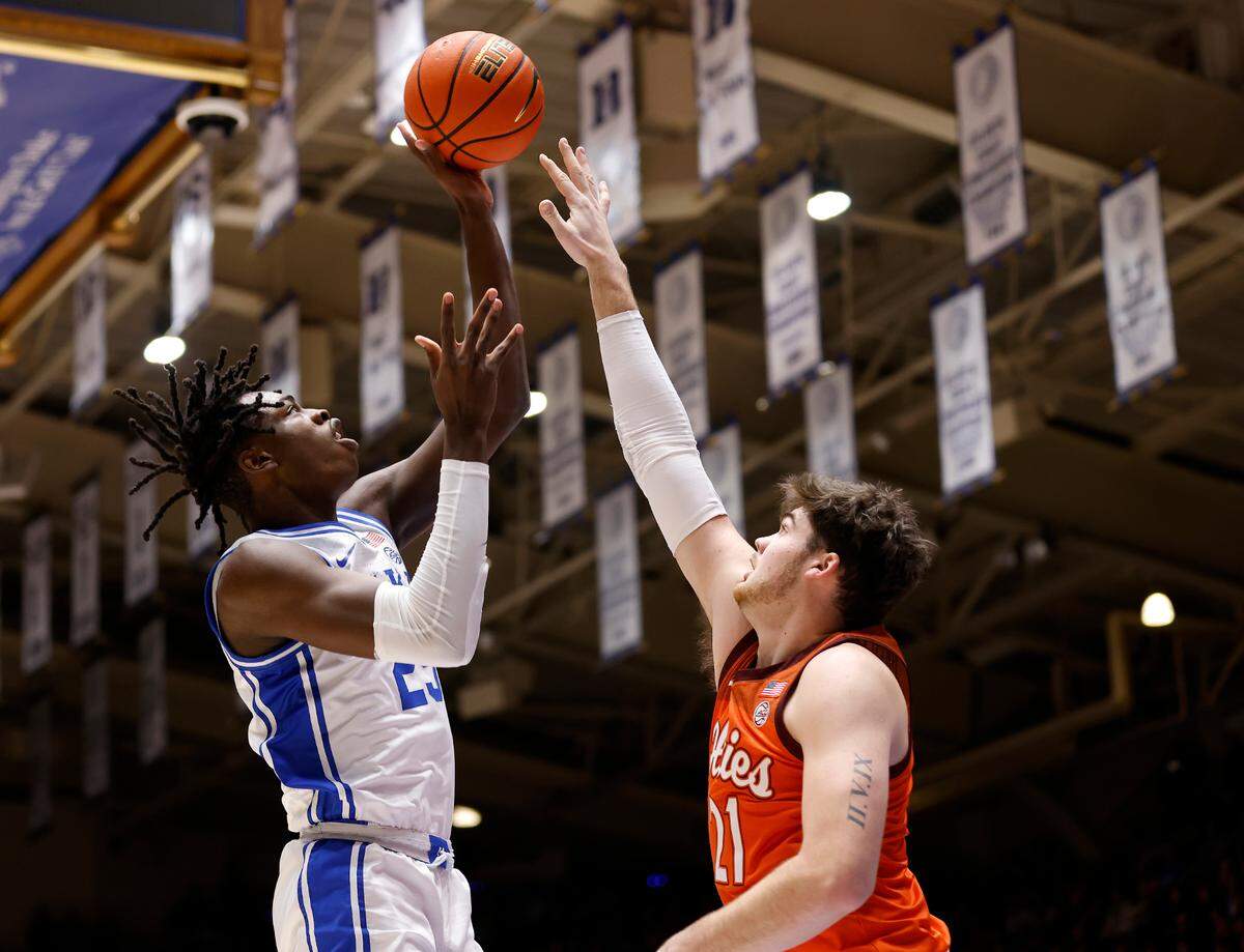 Duke’s Mark Mitchell shoots over Virginia Tech’s Grant Basile during the first half of the Blue Devils’ game against Virginia Tech on Saturday, Feb. 25, 2023, at Cameron Indoor Stadium in Durham, N.C.
