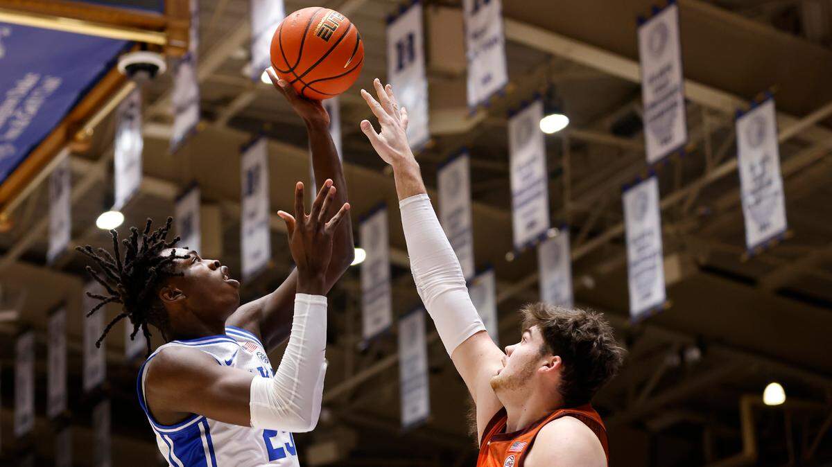 Duke’s Mark Mitchell shoots over Virginia Tech’s Grant Basile during the first half of the Blue Devils’ game against Virginia Tech on Saturday, Feb. 25, 2023, at Cameron Indoor Stadium in Durham, N.C.