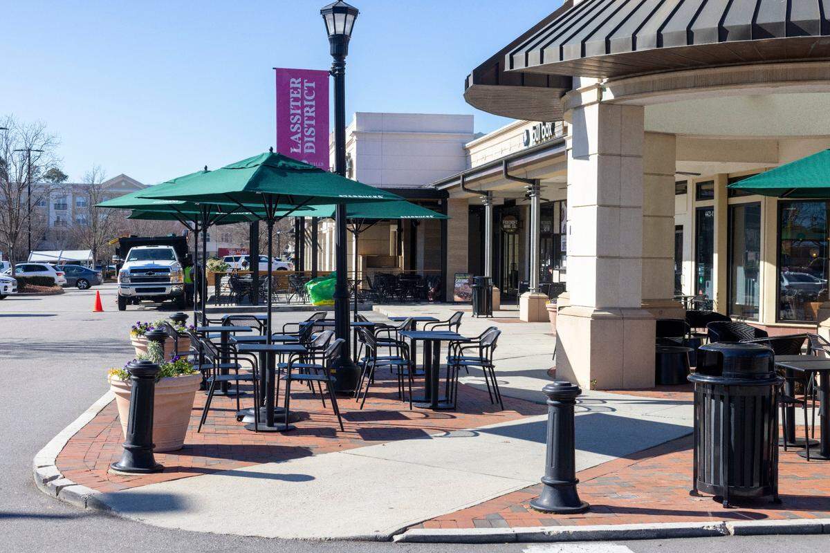 The outdoor seating art Starbucks on Lassiter Mill Road would usually be crowded during the lunch hour, but all is quiet as businesses are shut down as police investigate a shooting nearby on Friday, January 17, 2025 in Raleigh, N.C.