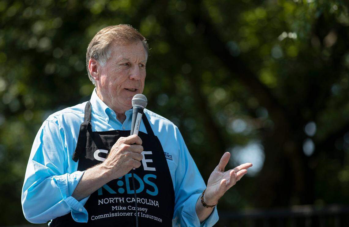 North Carolina Insurance Commissioner Mike Causey speaks about the importance of keeping kids and pets safe during an event held to demonstrate the danger of hot cars on Thursday, July 27, 2023, at Pullen Park in Raleigh, N.C.