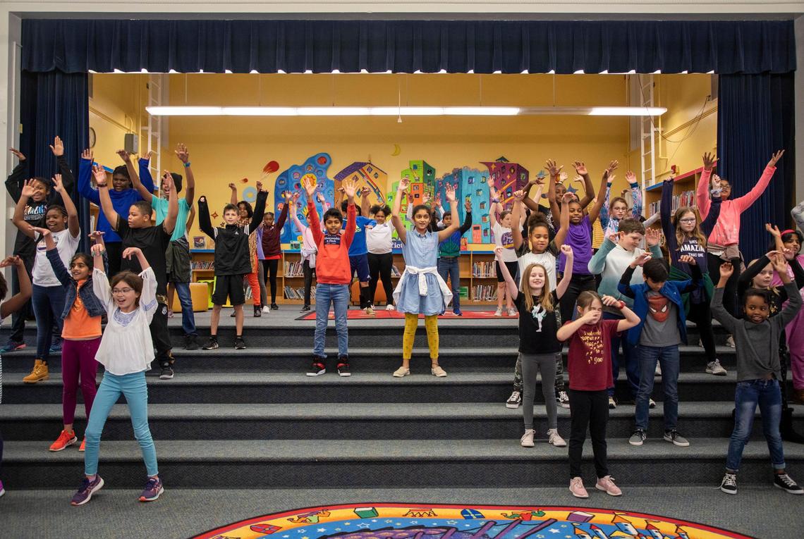 Drama production students perform the opening scene of their upcoming play during the Magnet Theme Showcase at Washington Magnet Elementary School, where parents learn about what the school may offer their child if they are accepted, on Tuesday, Jan. 14, 2020, in Raleigh, N.C.