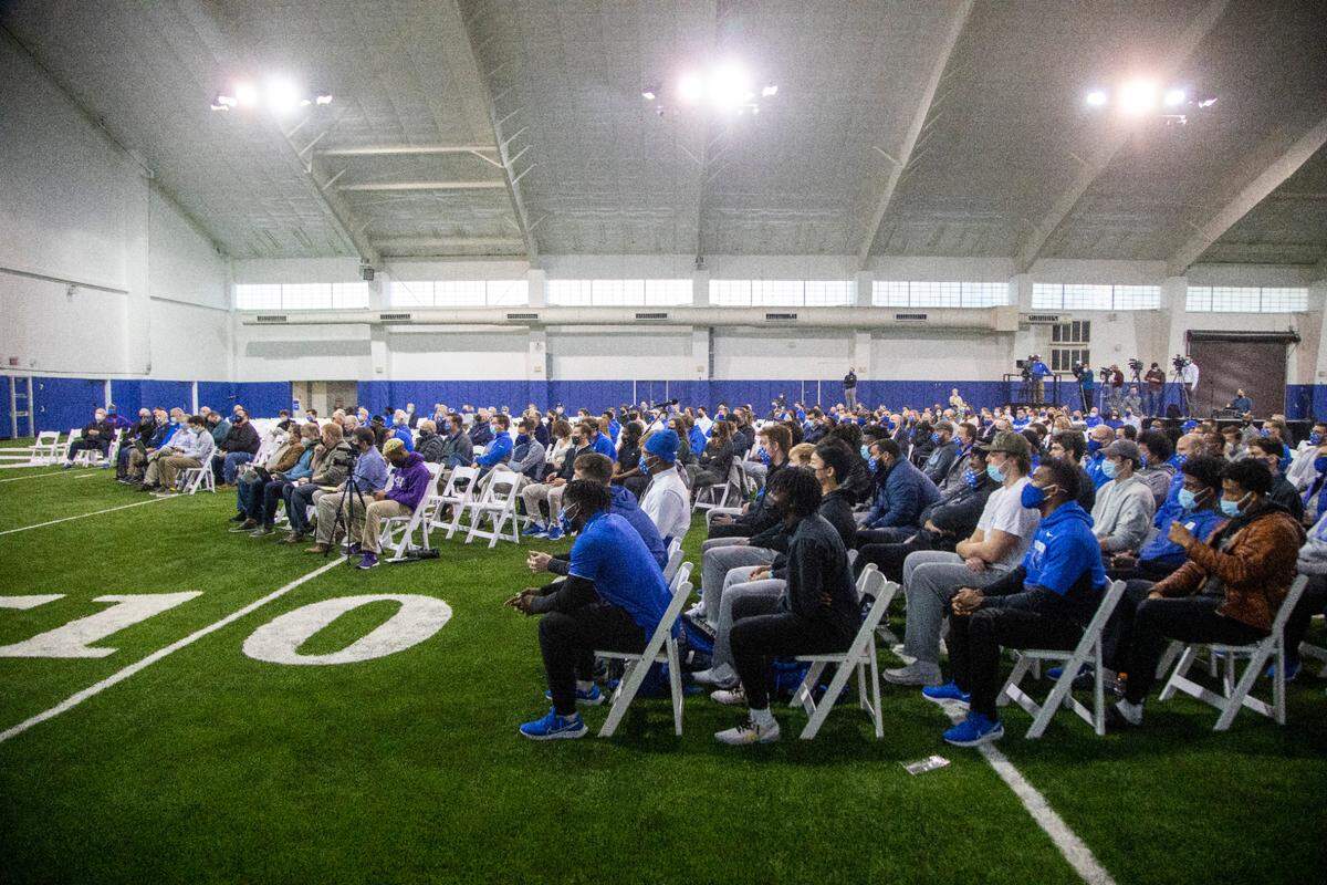 Players, reporters, staff and fans watch as Mike Elko is introduced as Duke’s head football coach during a press conference at Pascal Field House in Durham, Monday, Dec. 13, 2021.