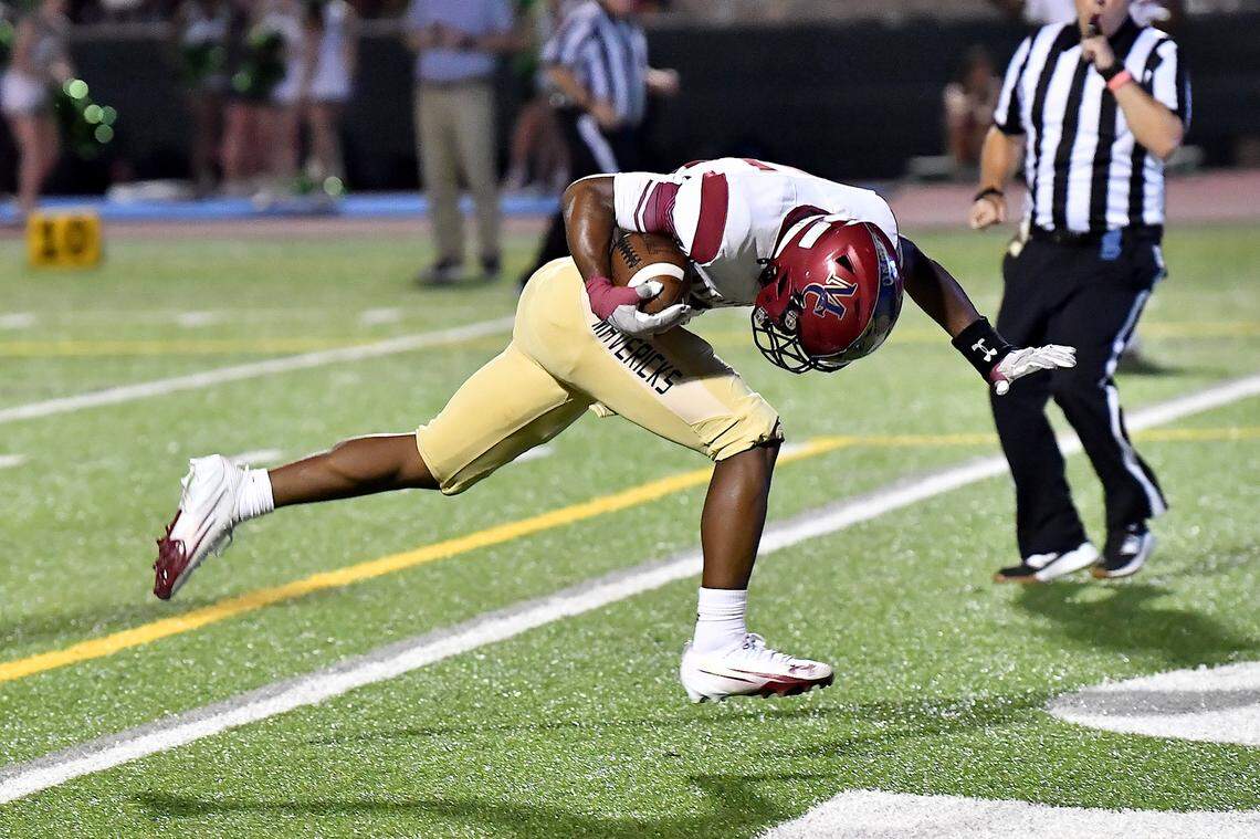 Mallard Creek running back Xavier Edmond (21) leaps and leans in for the touchdown against Cardinal Gibbons during the first half. The Mallard Creek Mavericks and the Cardinal Gibbons Crusaders met in a non-conference football game in Raleigh, N.C. September 19, 2025