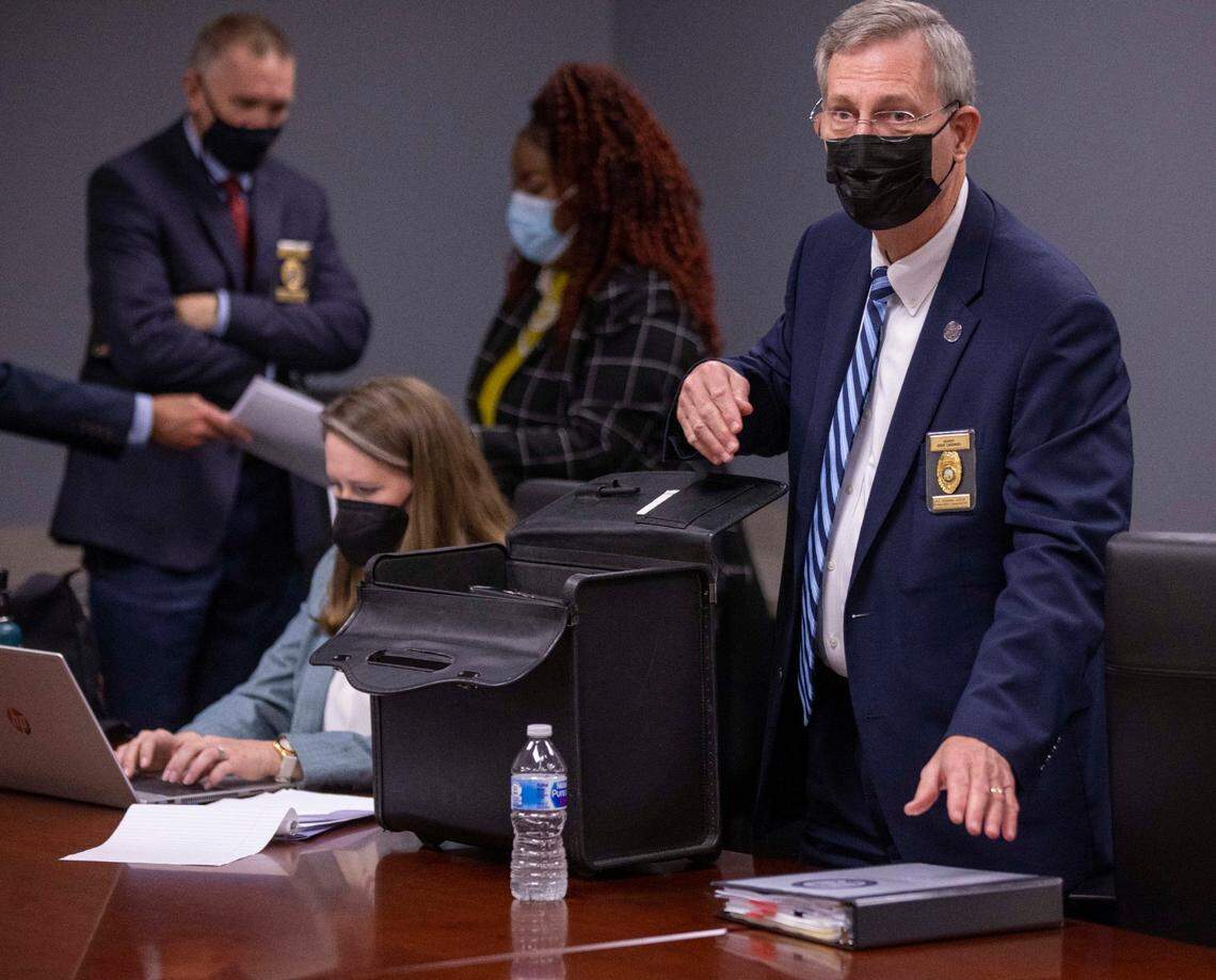 Eddie Caldwell, Executive Vice President and General Counsel for the North Carolina Sheriffs’ Association, packs his brief case following a Criminal Justice Standards Training Commission subcommittee meeting on Thursday, November 18, 2021 at Wake Tech Community College in Raleigh N.C.