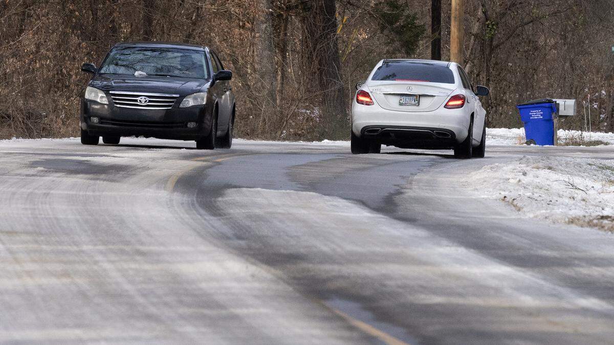 Some roads, like this stretch of hill W. Cornwallis Road in Durham County still have large patches of ice Friday following last weekend’s winter storm.