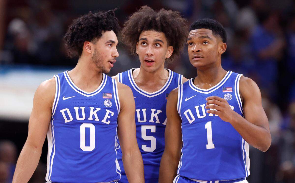 Duke’s Jared McCain (0), Tyrese Proctor (5) and Caleb Foster (1) talk after a timeout during the first half of Duke’s game against Michigan State in the Champions Classic at the United Center in Chicago, IL, Tuesday, Nov. 14, 2023.