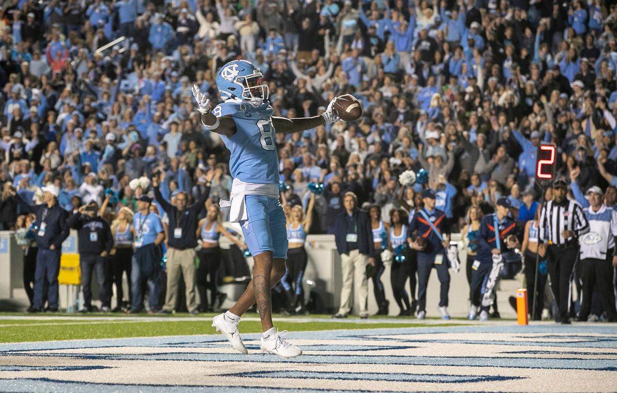 North Carolina wide receiver Kobe Paysour (8) reacts after scoring a touchdown on a one-yard pass from quarterback Drake Maye in the second quarter against Pitt on Saturday, October 29, 2022 at Kenan Stadium in Chapel Hill, N.C.