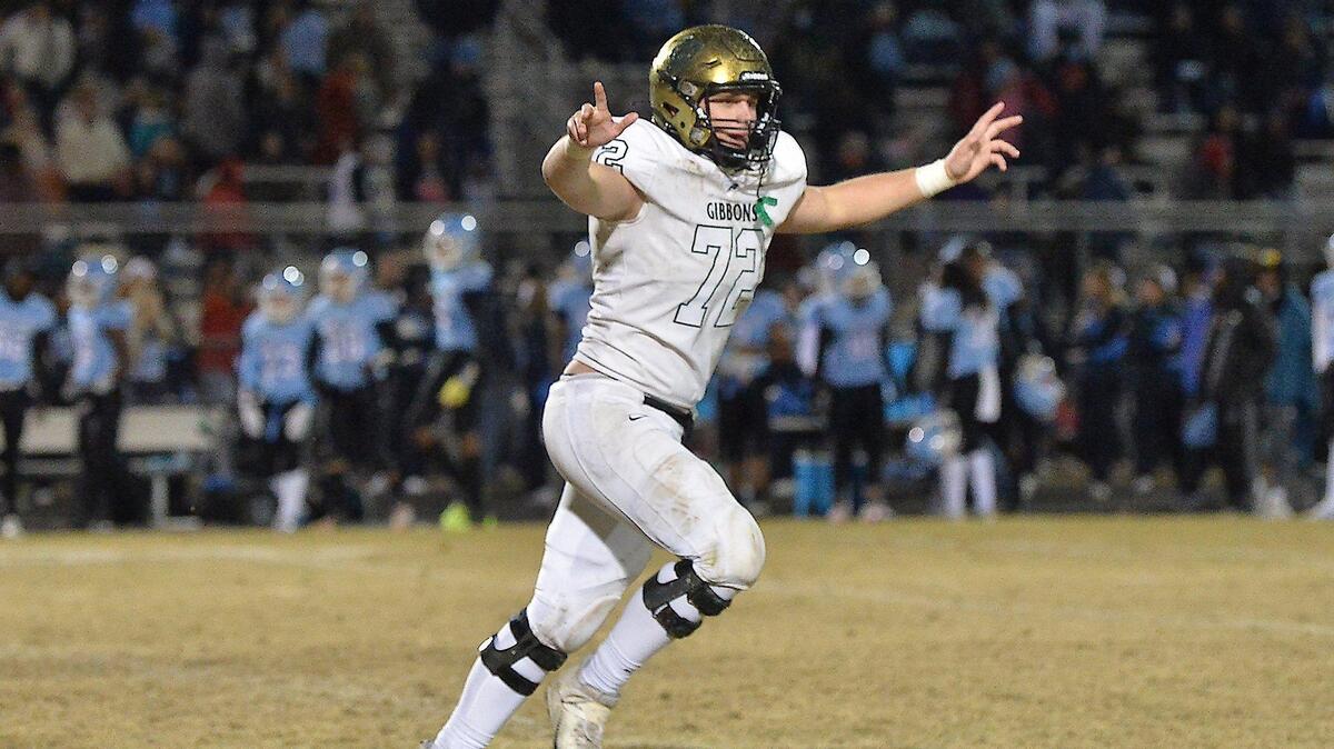 Cardinal Gibbons’ Cooper Sullivan reacts after Gibbons’ victory over Cleveland late in the 4th quarter. The Cardinal Gibbons Crusaders and the Cleveland Rams met in the third round of the NCHSAA 4A football playoffs on November 19, 2021