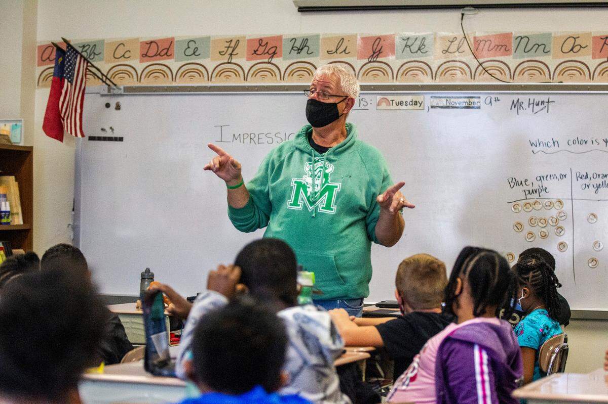 Jim Hunt, a retired art teacher, substitute teaches at Aversboro Elementary School in Garner Tuesday, Nov. 9, 2021. Aversboro has a 20 percent teacher vacancy rate.
