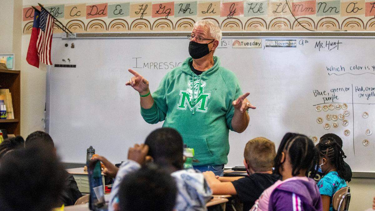 Jim Hunt, a retired art teacher, substitute teaches at Aversboro Elementary School in Garner in November 2021. Hunt was pressed into frequent service because of the large number of teacher vacancies.