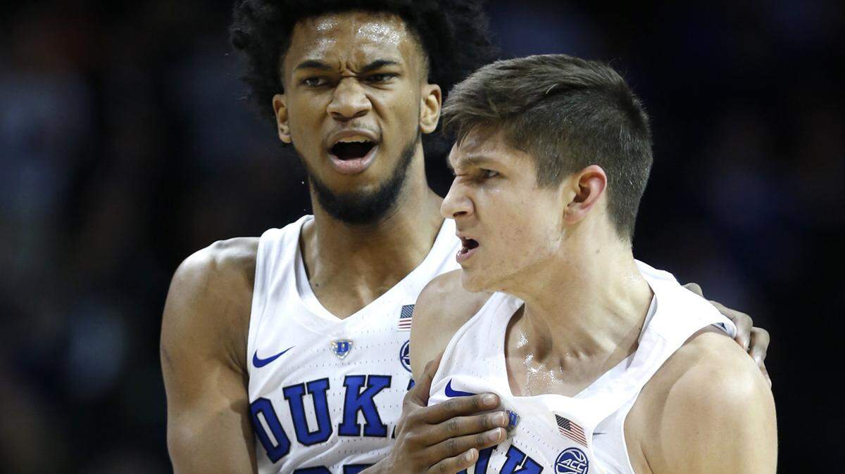 Duke's Grayson Allen (3) and Marvin Bagley III (35) celebrate during a timeout in the first half against Notre Dame.